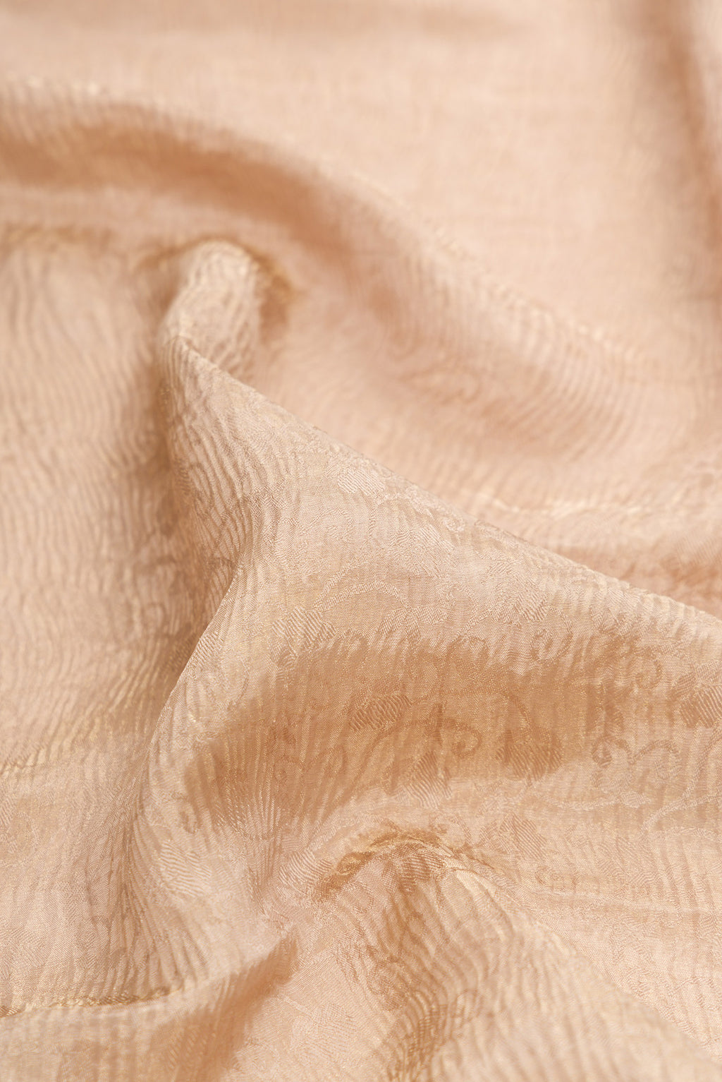 Close up of Dark Beige Dual Tone Mysore Crepe Saree with Zari Brocade on the body and Zari Border.  displaying folds