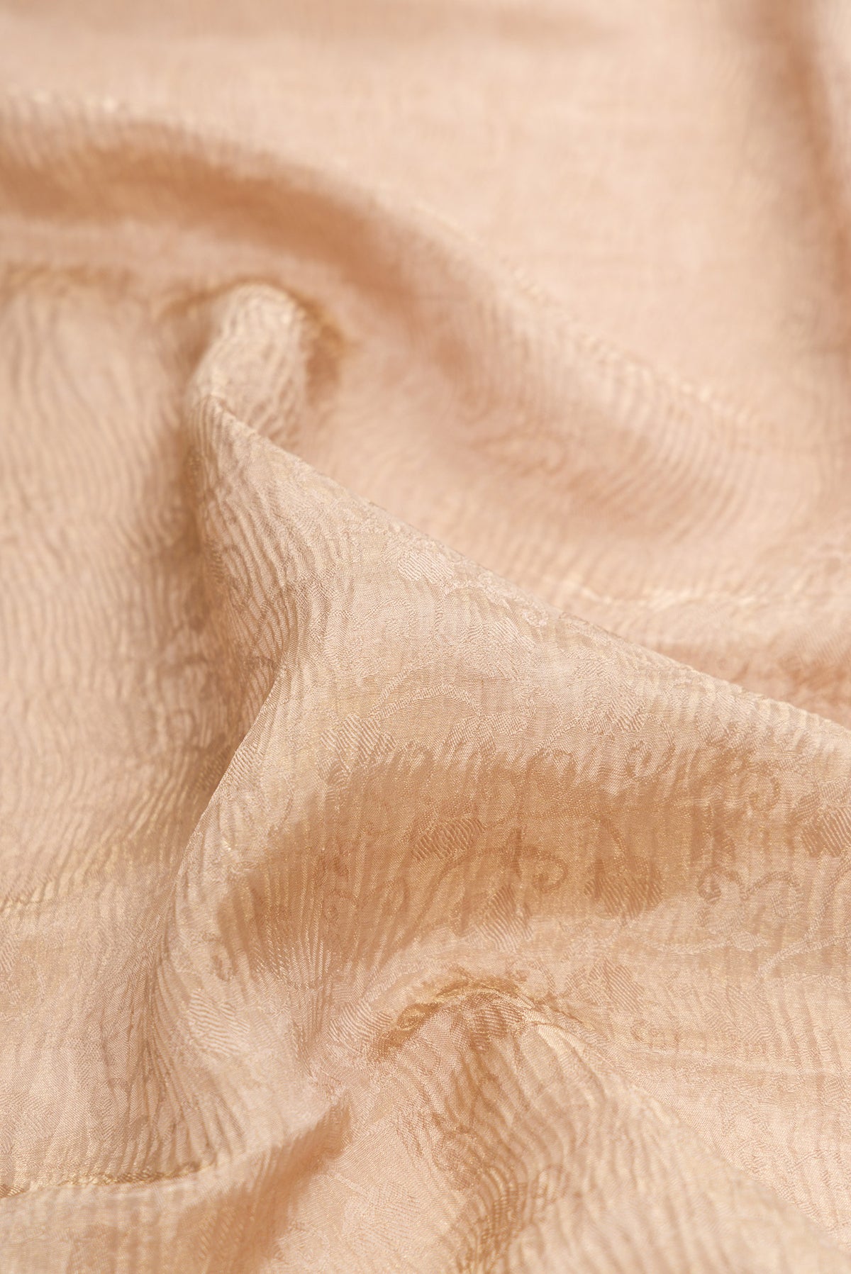 Close up of Dark Beige Dual Tone Mysore Crepe Saree with Zari Brocade on the body and Zari Border.  displaying folds