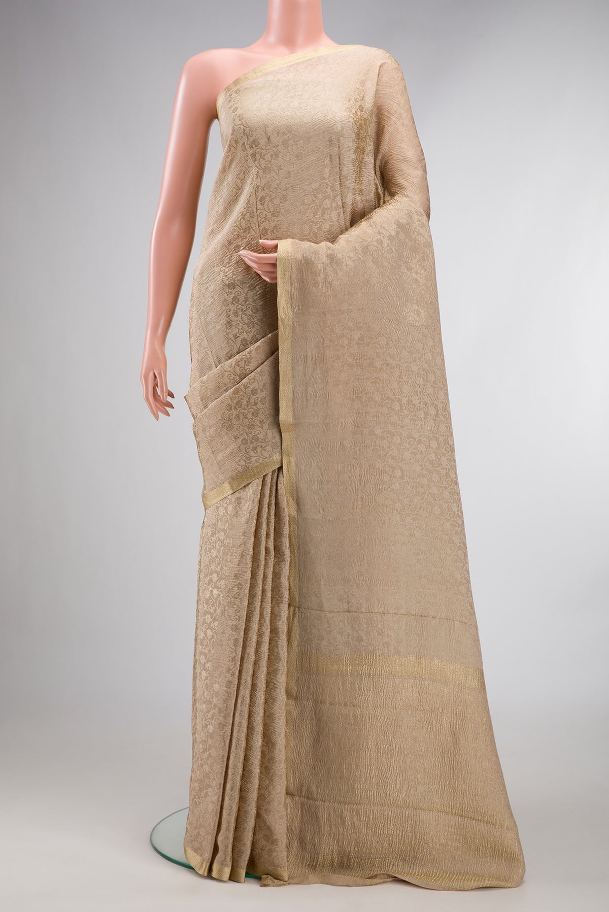 Dark Beige Dual Tone Mysore Crepe Saree with Zari Brocade on the body and Zari Border.  displayed on a mannequin