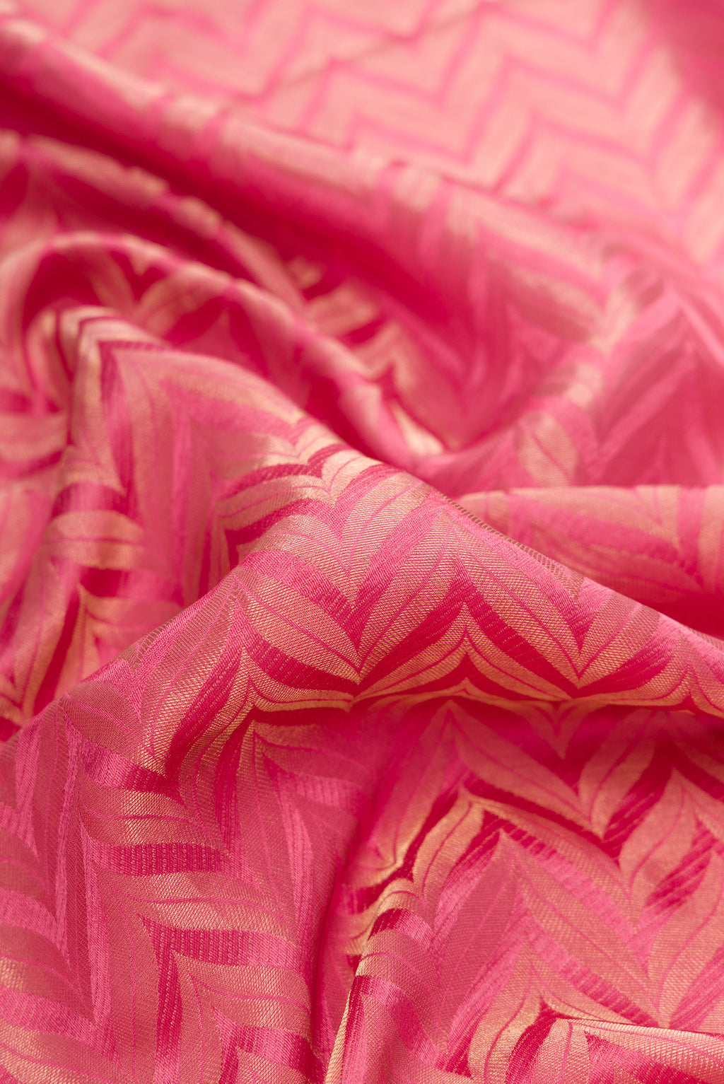 Close up of Pink Mysore Crepe Saree with Zari Brocade on the body and Zari Border.  displaying folds