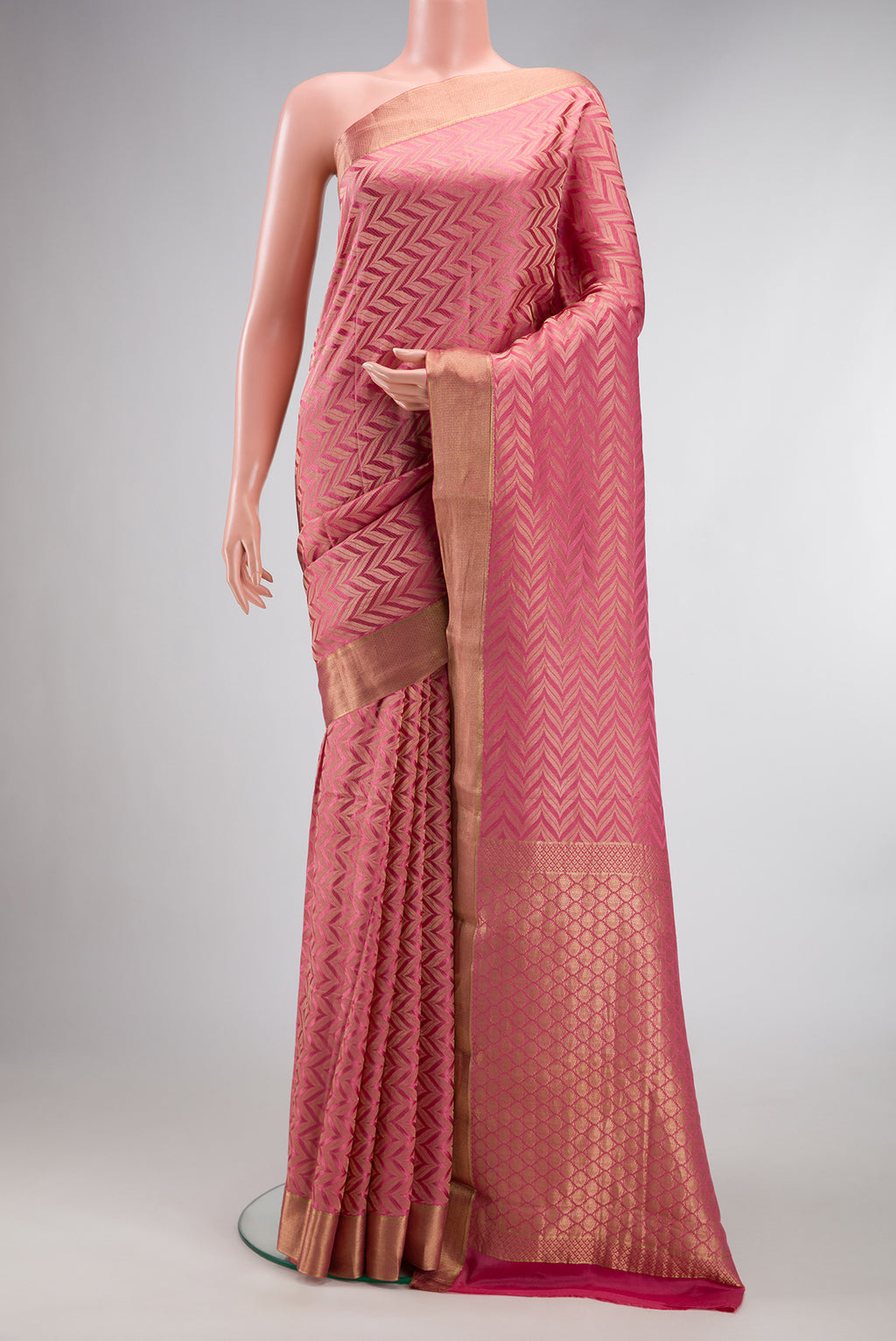 Pink Mysore Crepe Saree with Zari Brocade on the body and Zari Border.  displayed on a mannequin