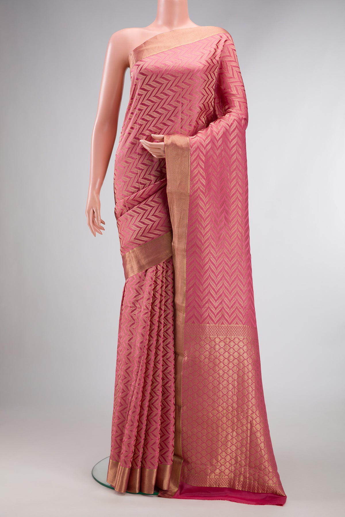 Pink Mysore Crepe Saree with Zari Brocade on the body and Zari Border.  displayed on a mannequin