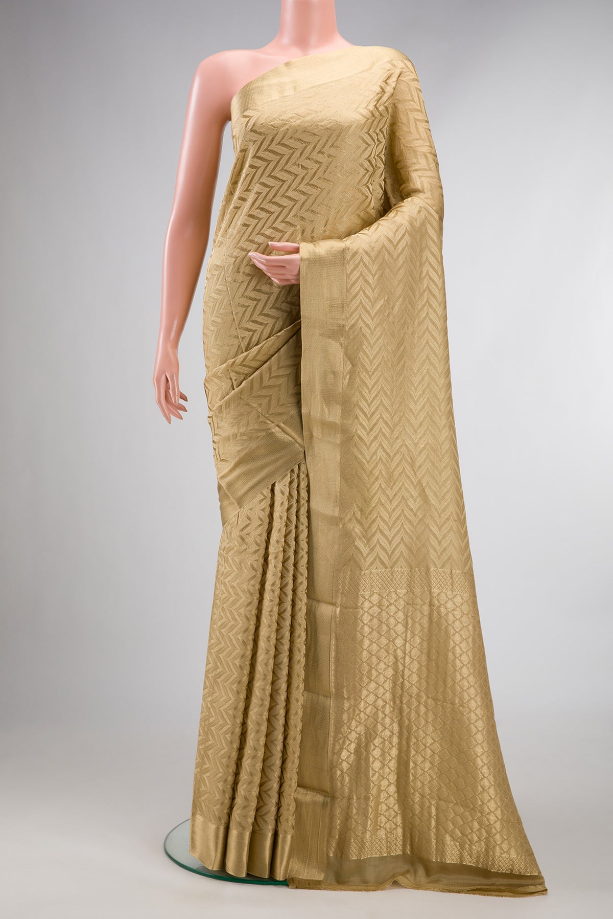 Dark Beige Mysore Crepe Saree with Zari Brocade on the body and Zari Border.  displayed on a mannequin