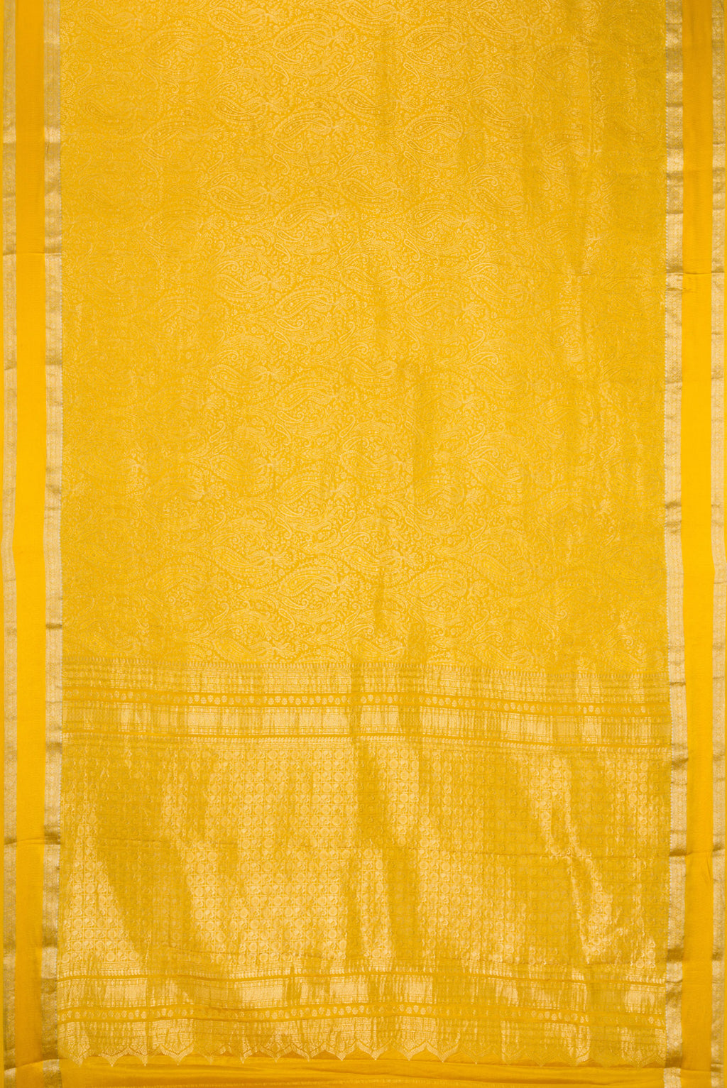 Flat view of Mustard Mysore Crepe Saree with Zari Brocade on the body and Zari Border. 