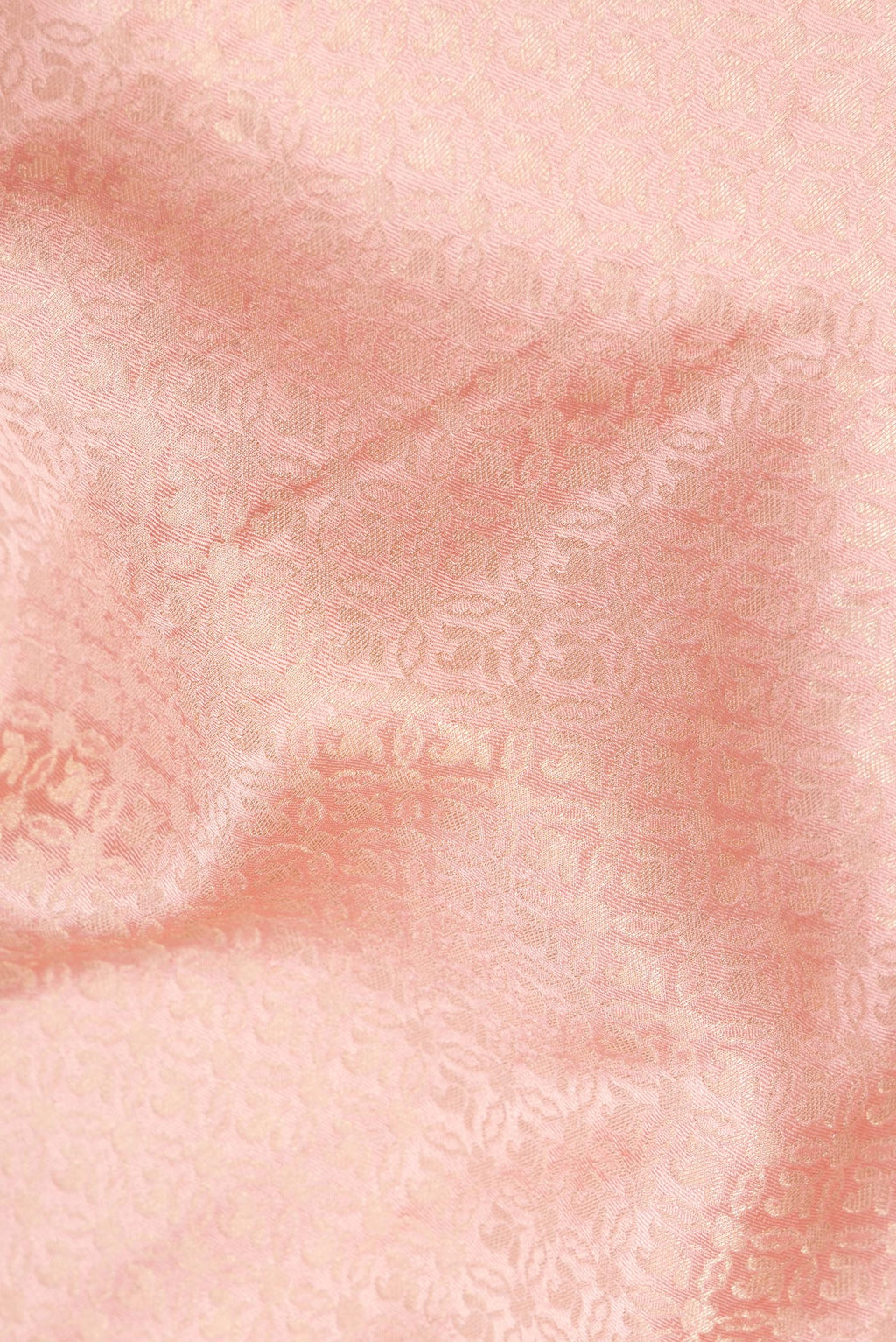 Close up of Peach Dual Tone Banarasi Georgette Saree with Zari Brocade on the body and Zari Border.  displaying folds