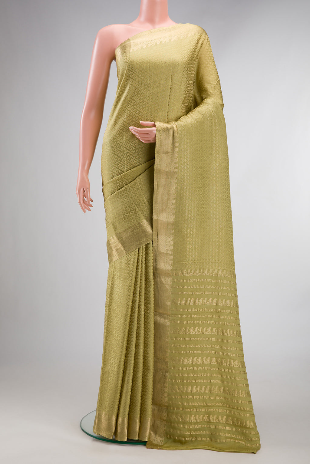 Pista Green Mysore Crepe Saree with Zari Brocade on the body and Zari Border.  displayed on a mannequin