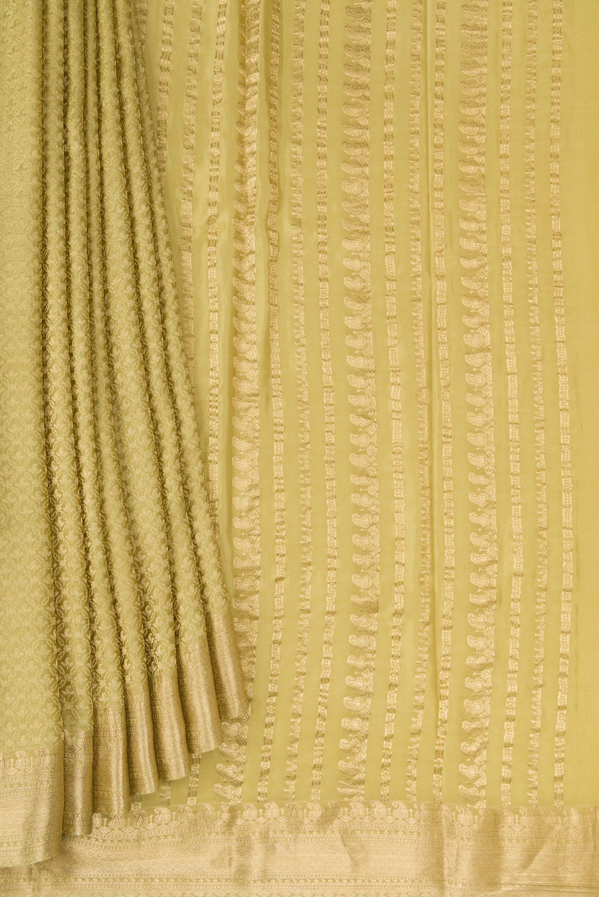 Pleats and pallu of Pista Green Mysore Crepe Saree with Zari Brocade on the body and Zari Border. 
