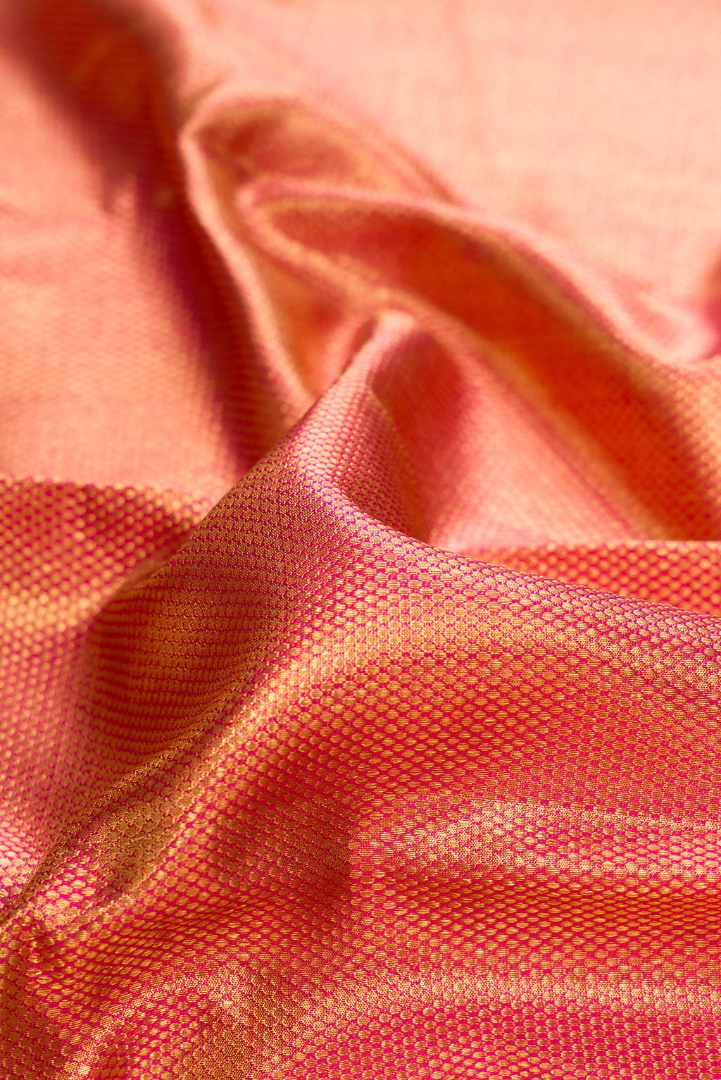 Close up of Pure Silk Pure Zari Pink Dual Tone Kanjivaram Tissue Saree with Zari Brocade on the body and Zari Border.  displaying folds