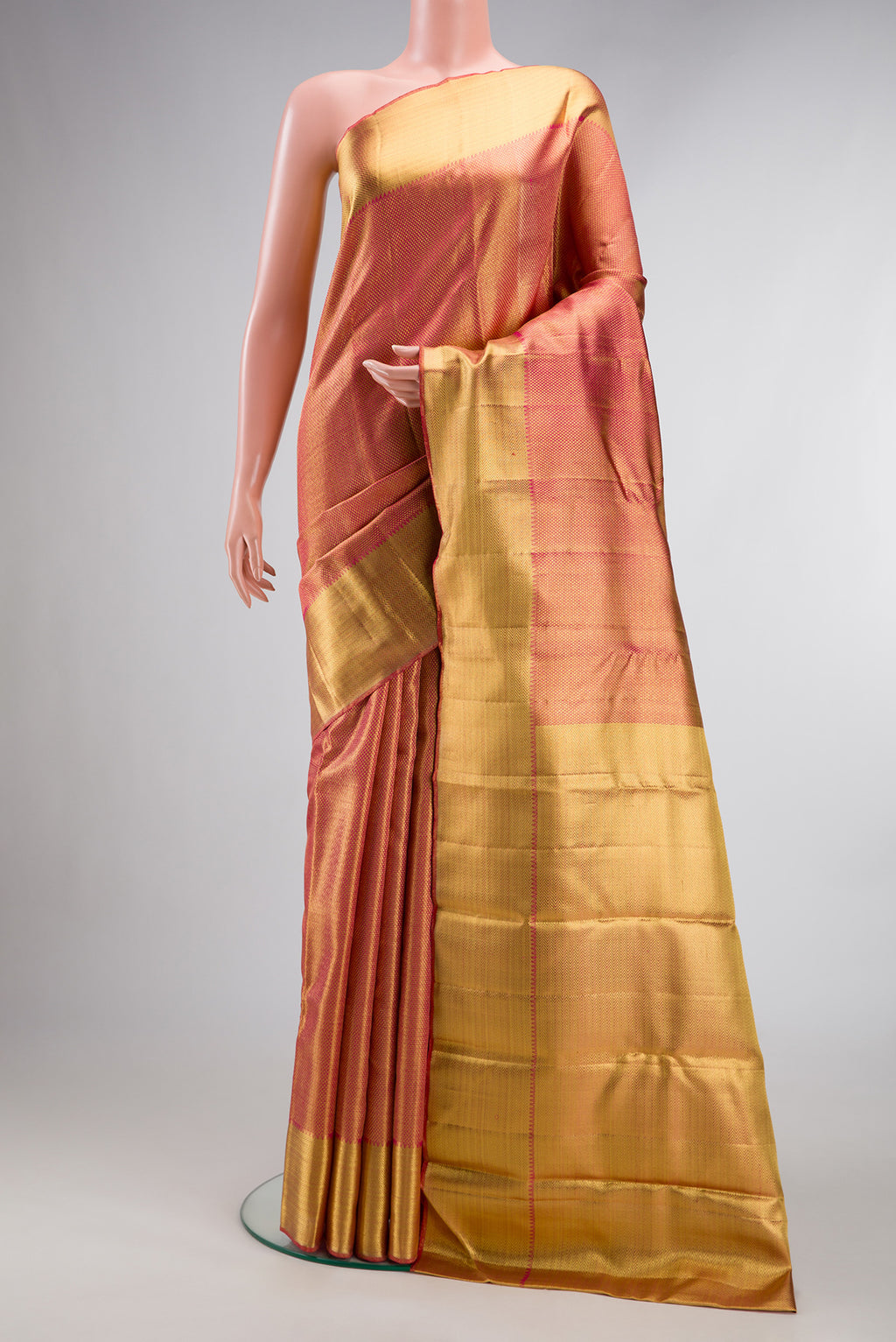 Pure Silk Pure Zari Pink Dual Tone Kanjivaram Tissue Saree with Zari Brocade on the body and Zari Border.  displayed on a mannequin