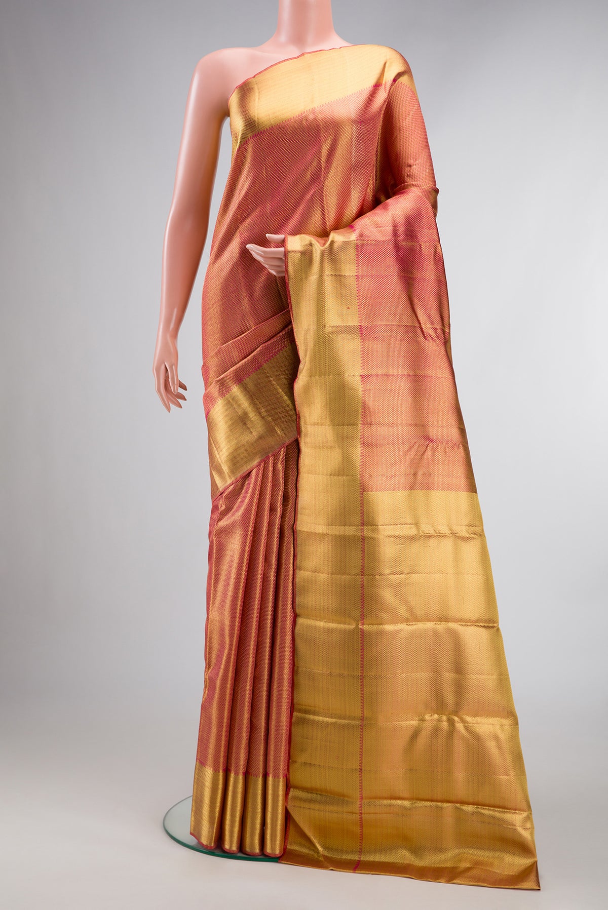 Pure Silk Pure Zari Pink Dual Tone Kanjivaram Tissue Saree with Zari Brocade on the body and Zari Border.  displayed on a mannequin