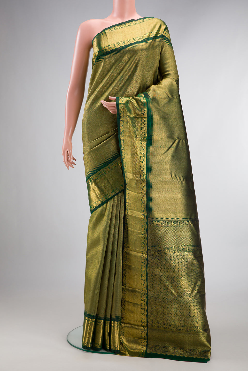 Pure Silk Pure Zari Green Dual Tone Kanjivaram Saree with Zari Brocade on the body and Zari Border.  displayed on a mannequin