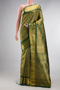 Pure Silk Pure Zari Green Dual Tone Kanjivaram Saree with Zari Brocade on the body and Zari Border.  displayed on a mannequin