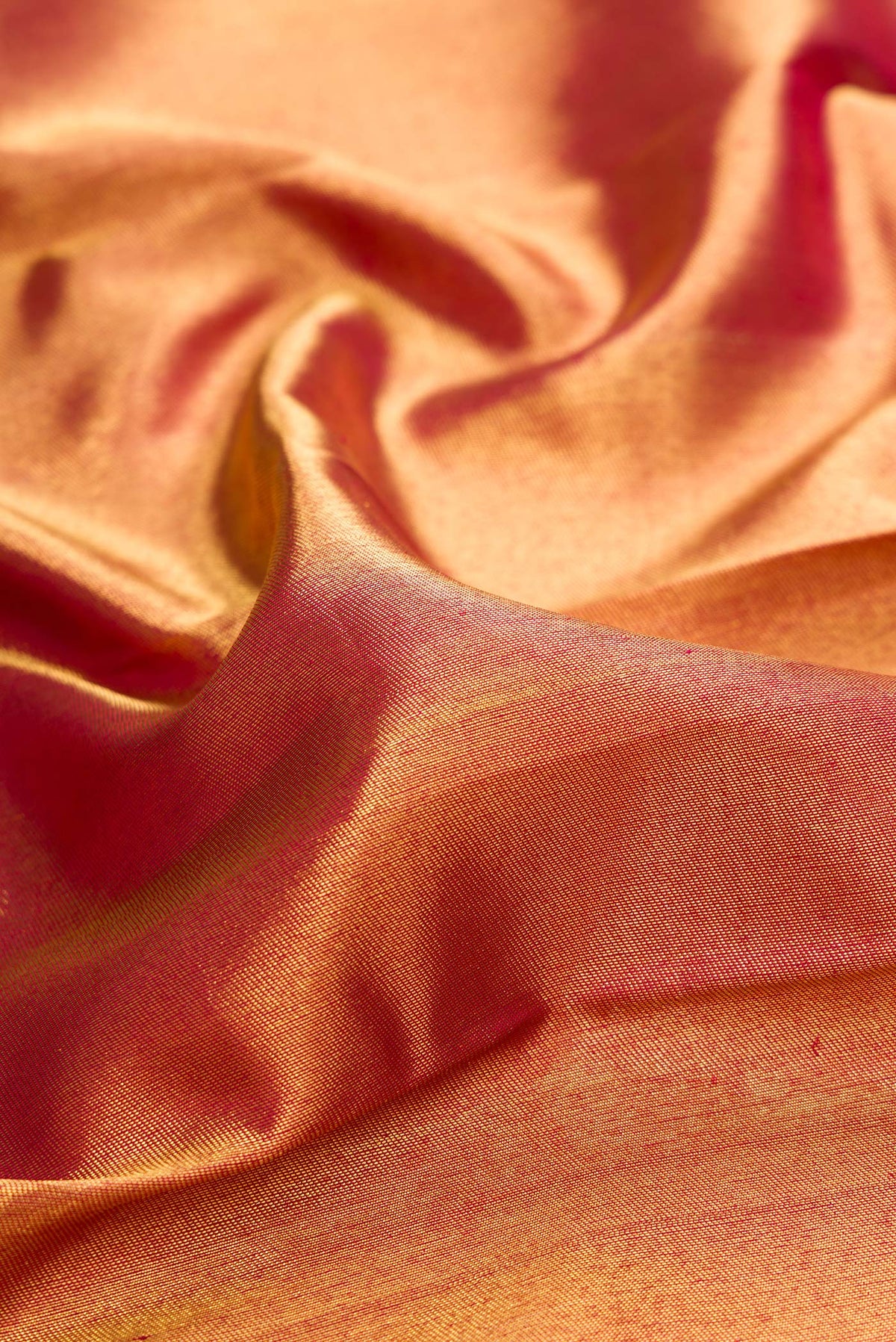 Close up of Pure Silk Pure Zari Dark Pink Dual Tone Kanjivaram Saree with Zari Brocade on the body and Zari Border.  displaying folds