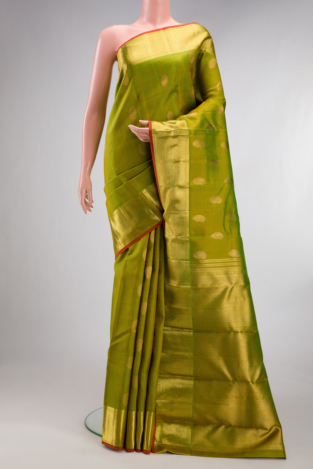 Pure Silk Pure Zari Parrot Green Dual Tone Kanjivaram Saree with Stripes on the body and Zari Border.  displayed on a mannequin