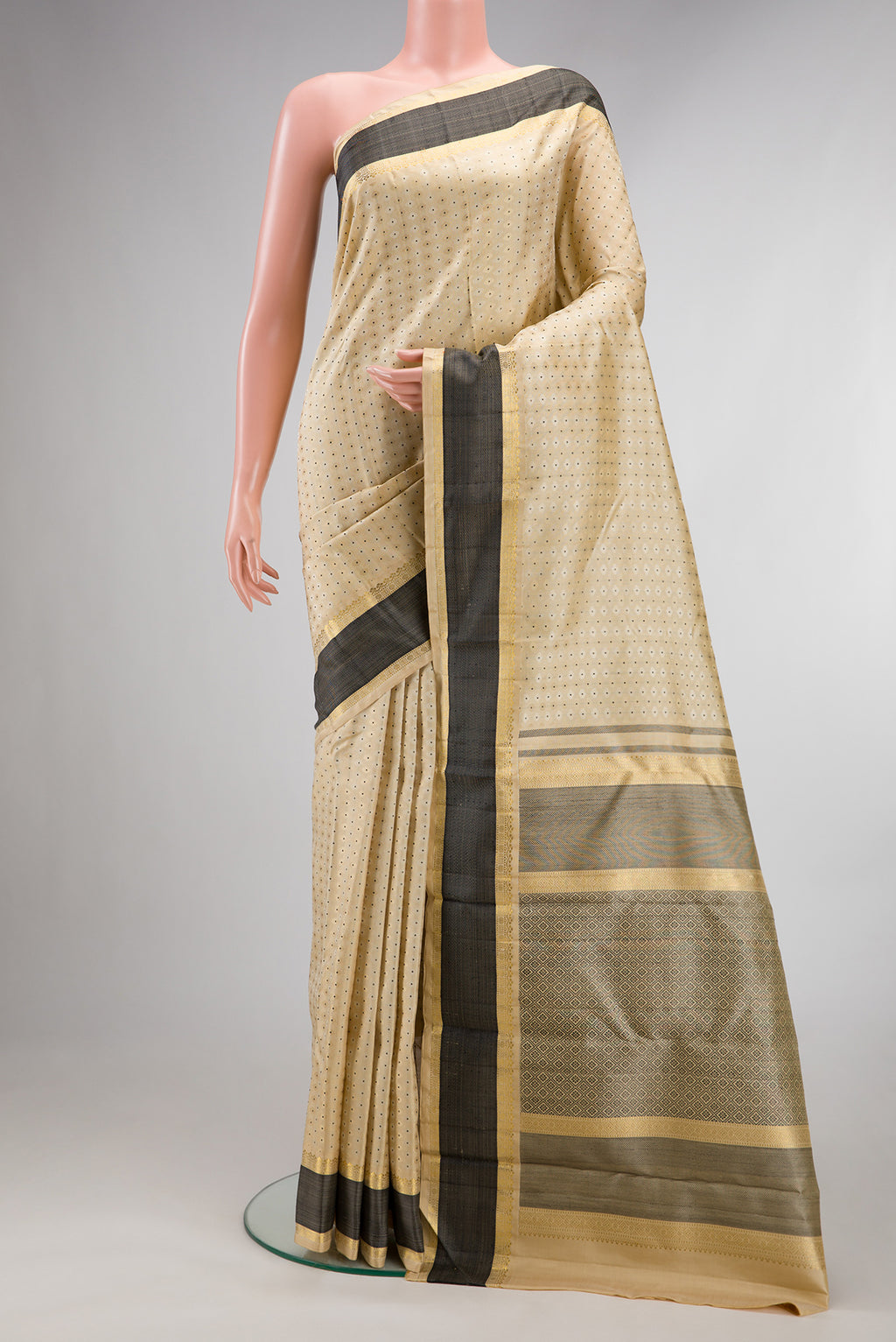 Pure Silk Sandal Kanchipuram Saree with Jacquard With Zari Butta on the body and Zari And Thread Border.  displayed on a mannequin