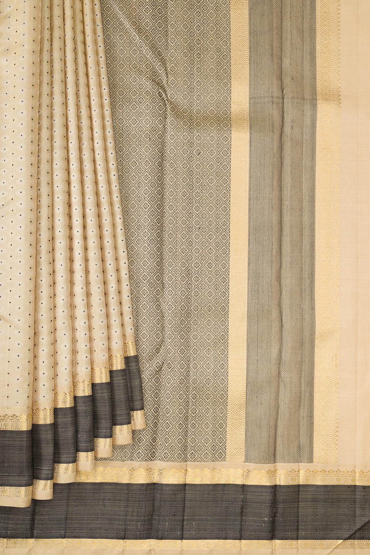 Pleats and pallu of Pure Silk Sandal Kanchipuram Saree with Jacquard With Zari Butta on the body and Zari And Thread Border. 