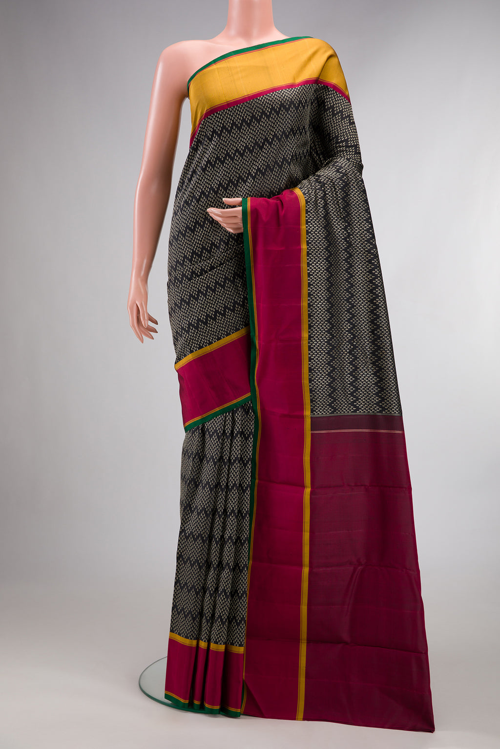 Pure Silk Coffee Brown Kanjivaram Saree with Jacquard design on the body and Ganga Jamuna Border.  displayed on a mannequin