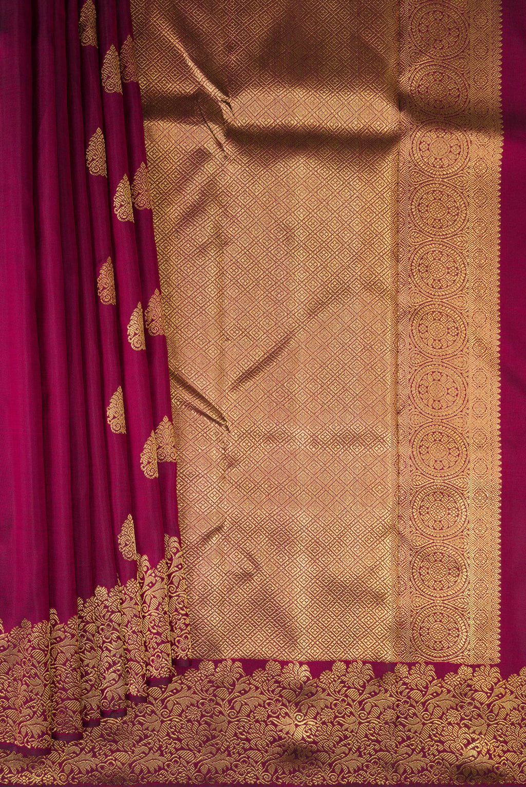 Pleats and pallu of Pure Silk Pure Zari Maroon Kanjivaram Saree with Zari Butta on the body and Fancy Border. 
