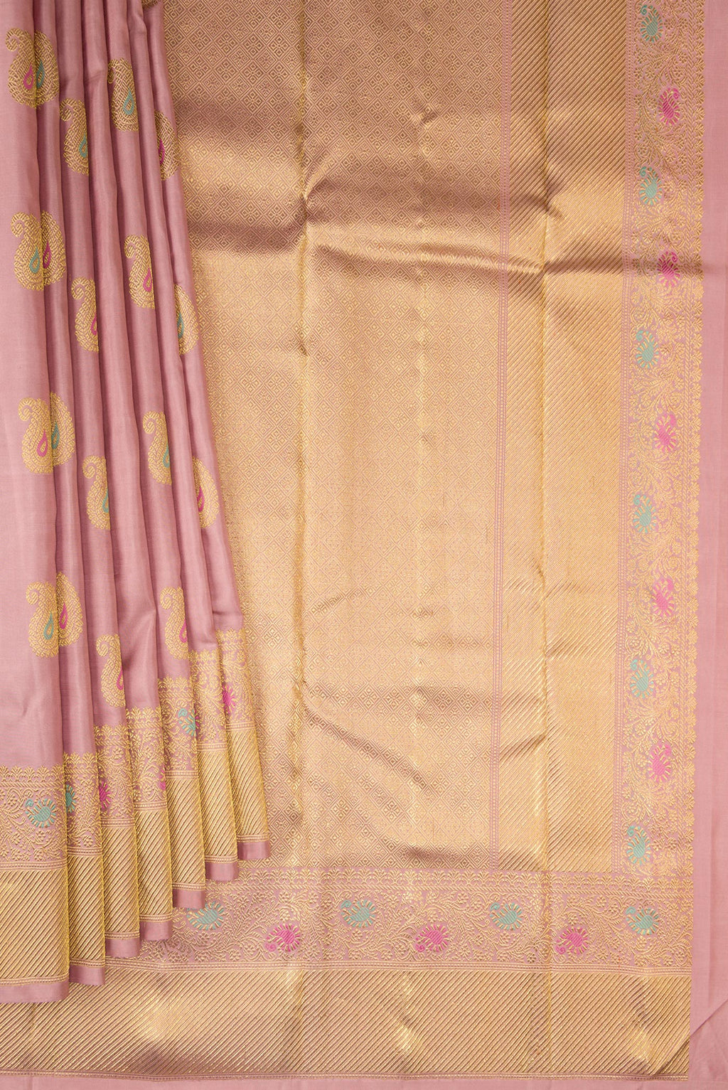 Pleats and pallu of Pure Silk Pure Zari Peach Kanjivaram Saree with Zari And Thread Butta on the body and Fancy Border. 