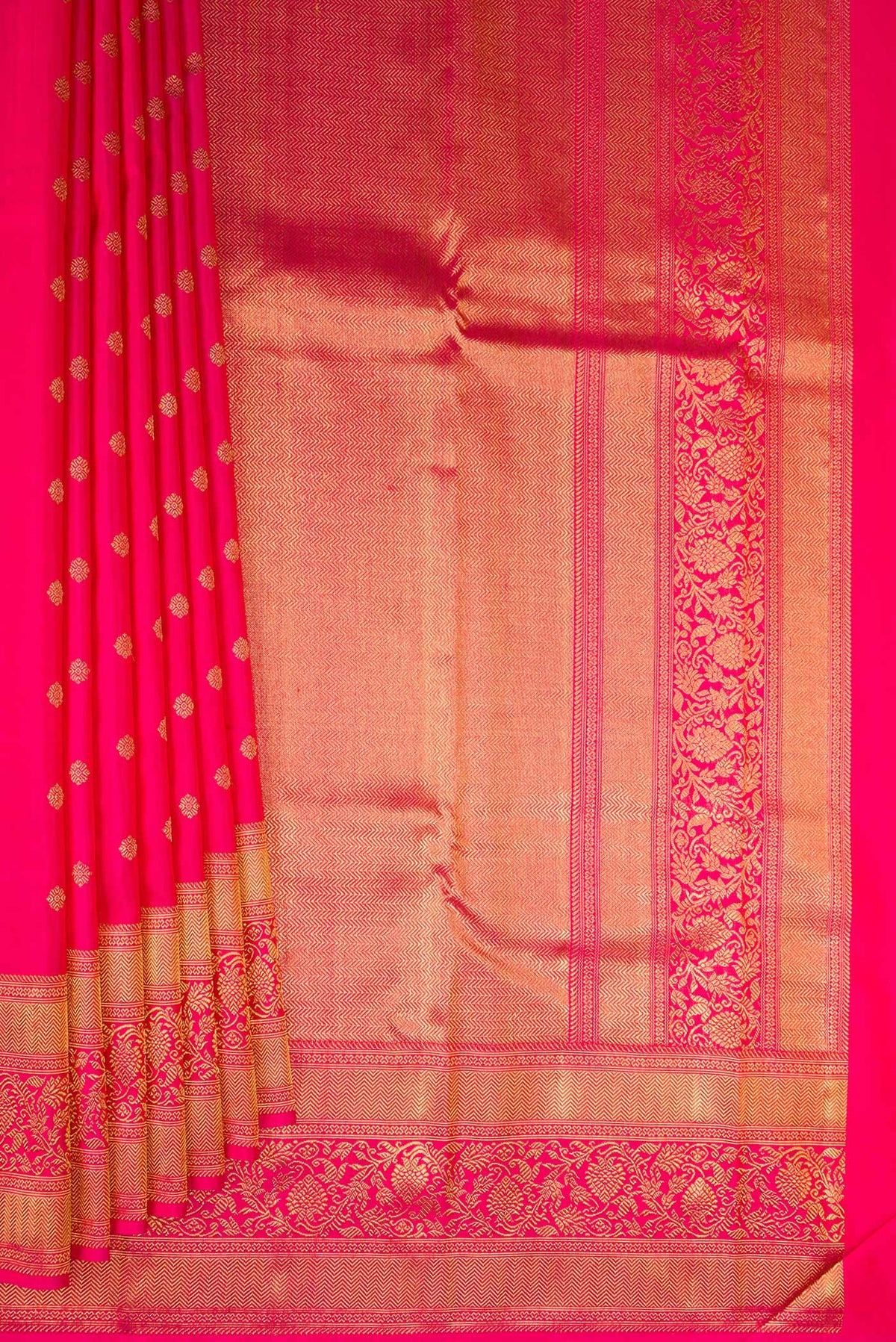 Pleats and pallu of Pure Silk Pure Zari Dark Pink Kanjivaram Saree with Zari Butta on the body and Fancy Border. 