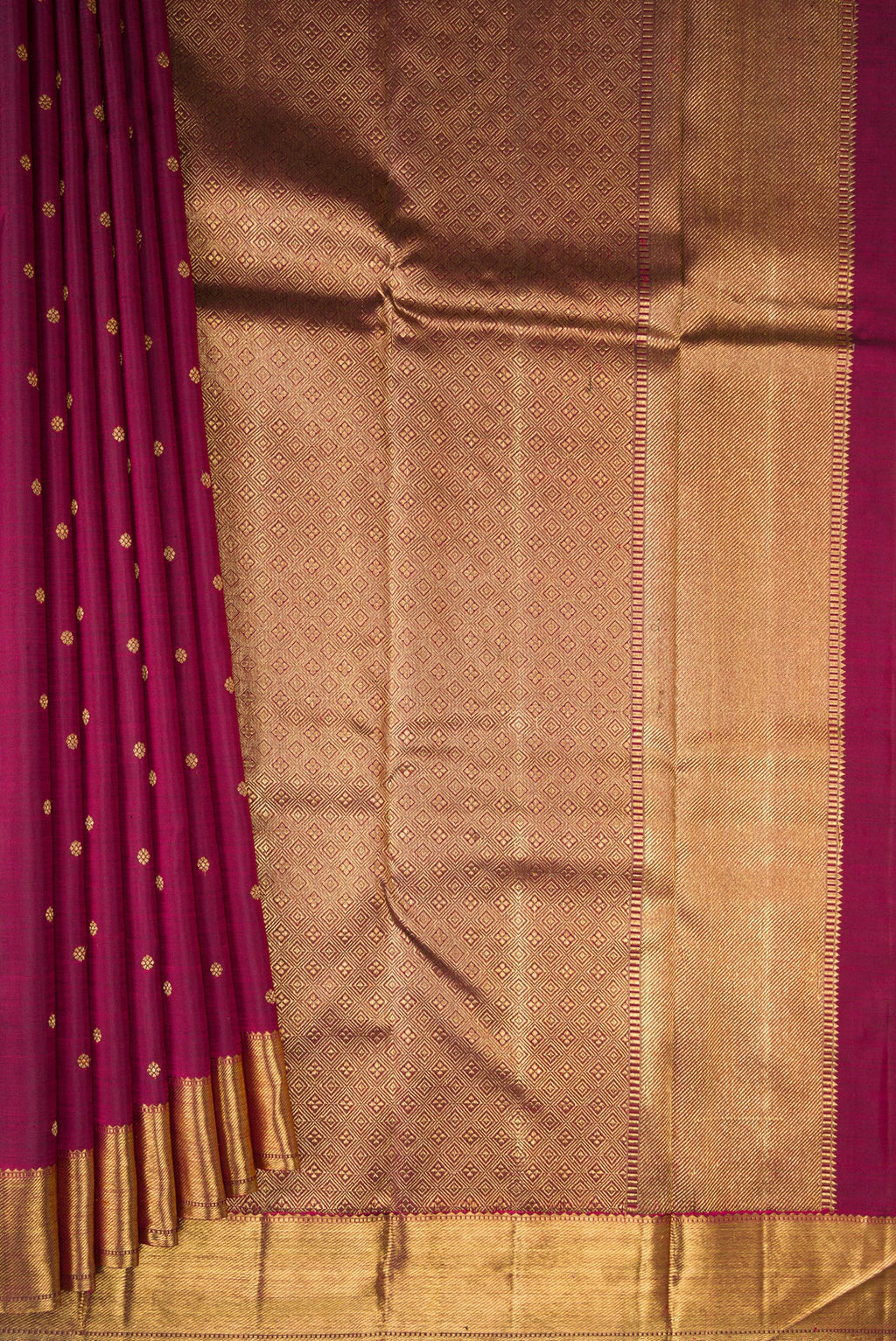 Pleats and pallu of Pure Silk Pure Zari Maroon Kanjivaram Saree with Zari Butta on the body and Zari Border. 