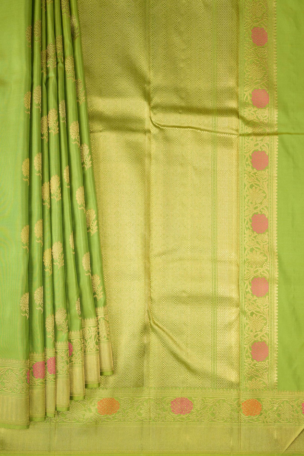 Pleats and pallu of Pure Silk Pure Zari Parrot Green Kanjivaram Saree with Zari And Thread Butta on the body and Fancy Border. 