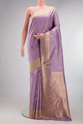 Pure Silk Pure Zari Lavender Dual Tone Kanjivaram Saree with Zari Butta on the body and Zari Border.  displayed on a mannequin