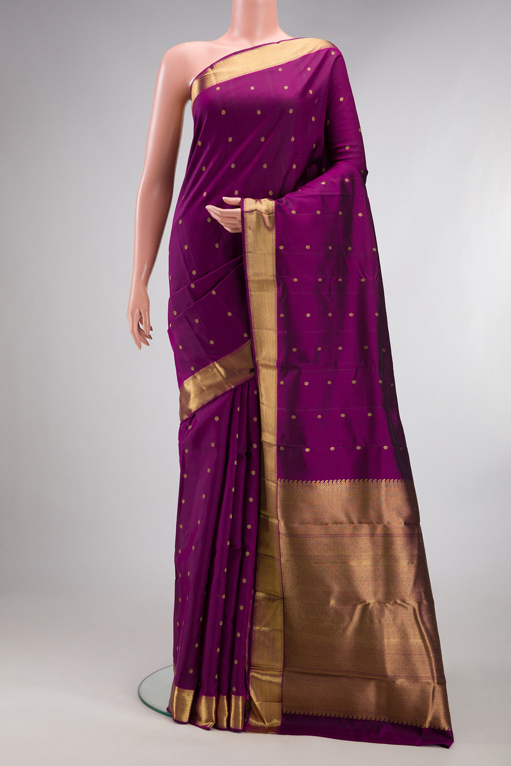 Pure Silk Pure Zari Purple Dual Tone Kanjivaram Saree with Zari Butta on the body and Zari Border.  displayed on a mannequin