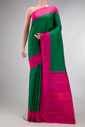 Pure Silk Green Kanjivaram Saree with Plain Body and Plain Border.  displayed on a mannequin