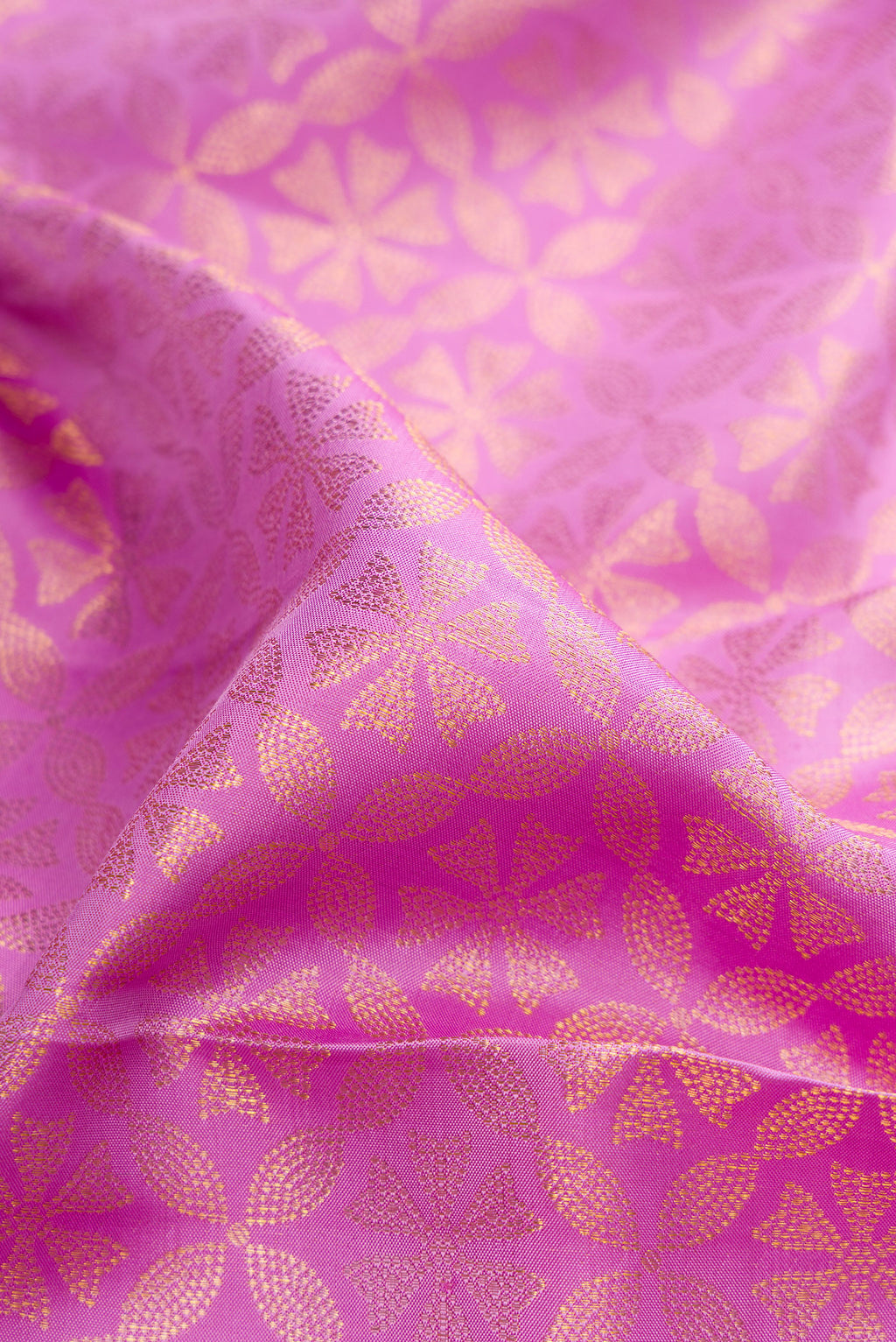 Close up of Pure Silk Lavender Kanjivaram Saree with Zari Brocade on the body and Zari Border.  displaying folds