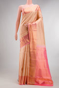 Pure Silk Golden Peach Dual Tone Kanchipuram Saree with Zari Brocade on the body and Zari Border.  displayed on a mannequin