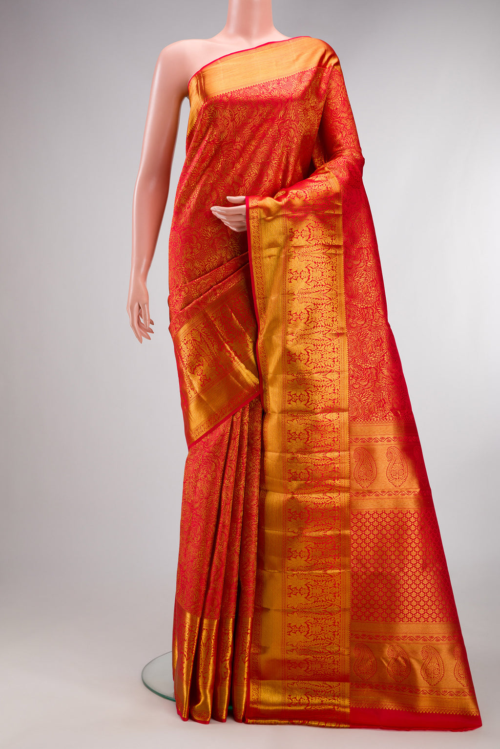 Pure Silk Red Dual Tone Kanchipuram Saree with Zari Brocade on the body and Zari Border.  displayed on a mannequin