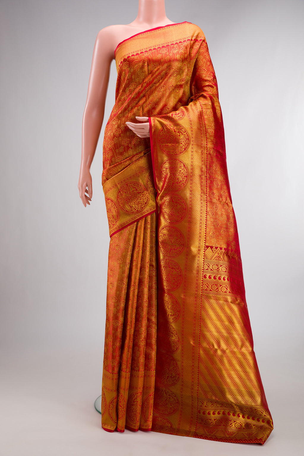 Pure Silk Red Kanchipuram Saree with Zari Brocade on the body and Fancy Border.  displayed on a mannequin