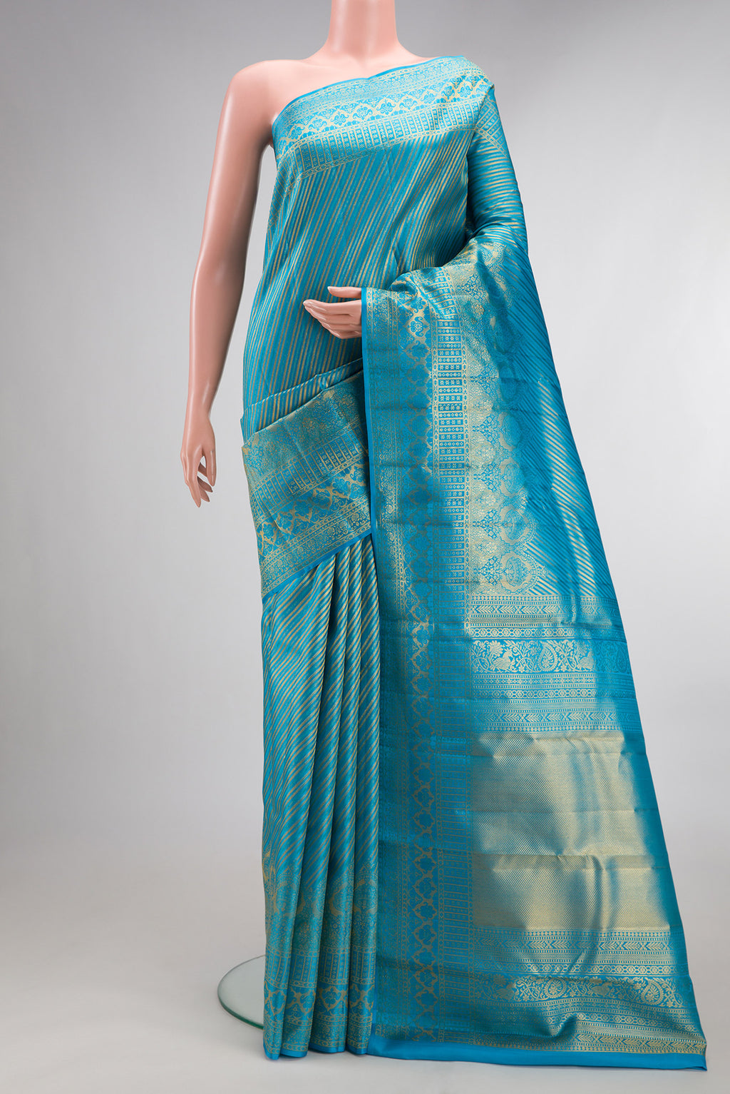 Pure Silk Sky Blue Kanchipuram Saree with Zari Brocade on the body and Fancy Border.  displayed on a mannequin