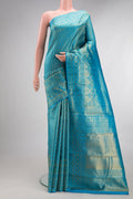 Pure Silk Sky Blue Kanchipuram Saree with Zari Brocade on the body and Fancy Border.  displayed on a mannequin