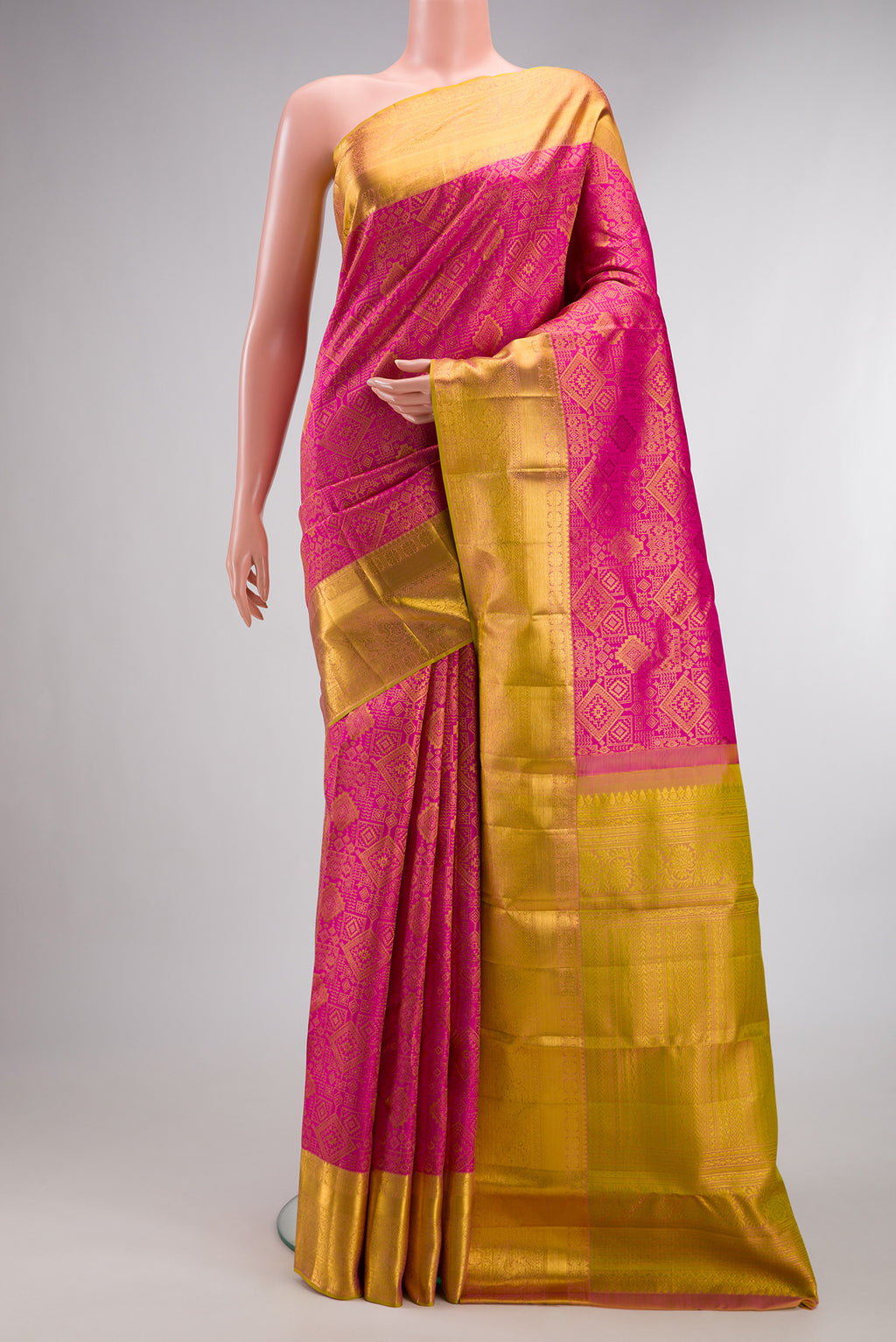 Pure Silk Pink Kanchipuram Saree with Zari Brocade on the body and Zari Border.  displayed on a mannequin