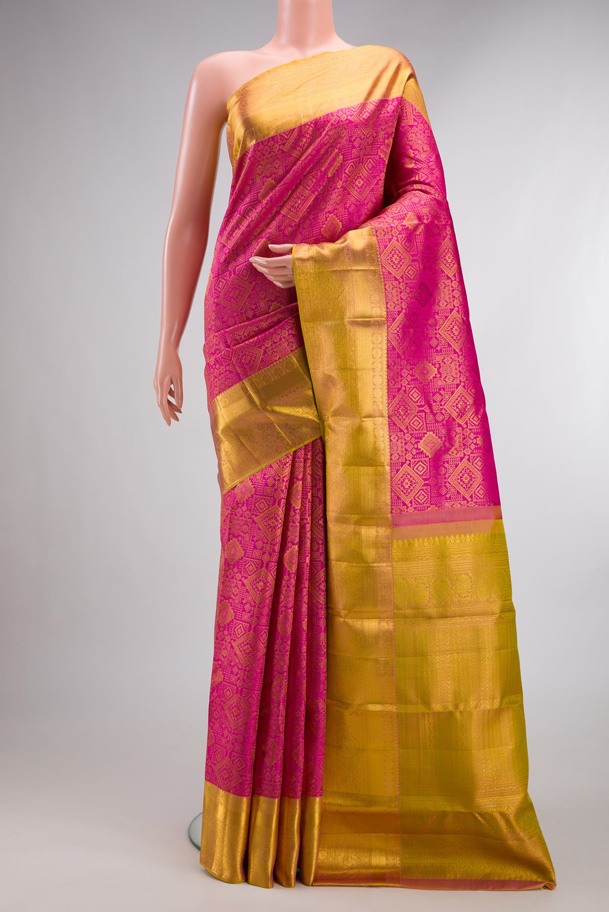 Pure Silk Pink Kanchipuram Saree with Zari Brocade on the body and Zari Border.  displayed on a mannequin