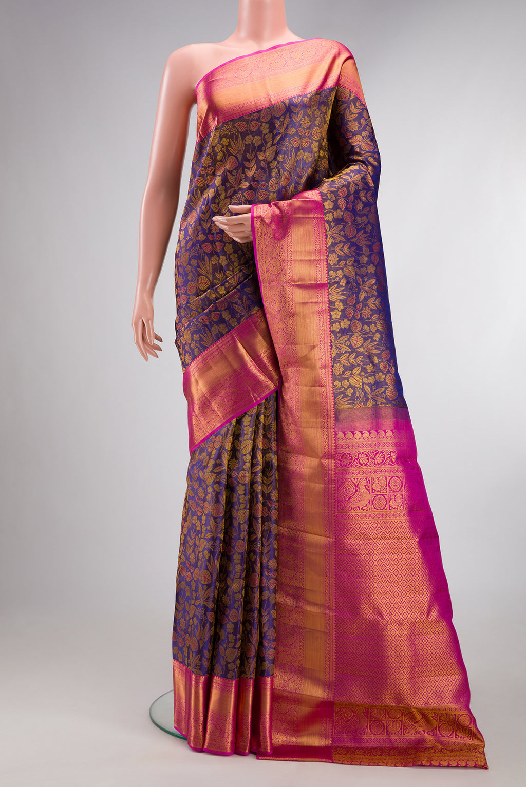 Pure Silk Purple Dual Tone Kanchipuram Tissue Saree with Zari Brocade on the body and Zari Border.  displayed on a mannequin