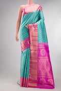 Pure Silk Light Blue Kanjivaram Tissue Saree with Zari Brocade on the body and Zari Border.  displayed on a mannequin