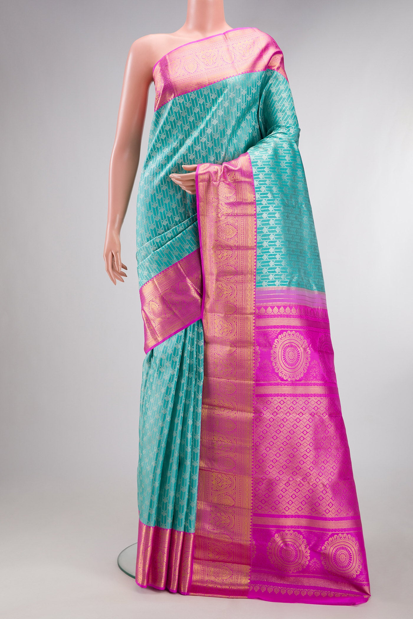 Pure Silk Light Blue Kanjivaram Tissue Saree with Zari Brocade on the body and Zari Border.  displayed on a mannequin