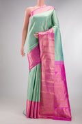 Pure Silk Light Blue Kanjivaram Saree with Zari Brocade on the body and Zari Border.  displayed on a mannequin