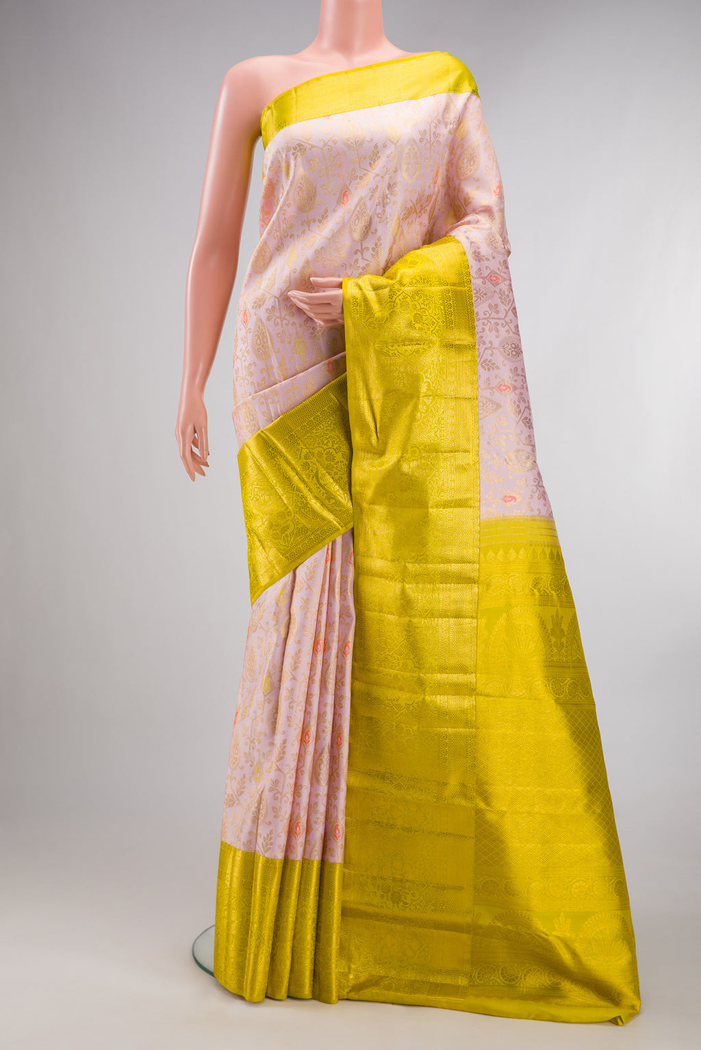 Pure Silk Rose Gold Dual Tone Kanjivaram Saree with Zari Brocade on the body and Zari Border.  displayed on a mannequin