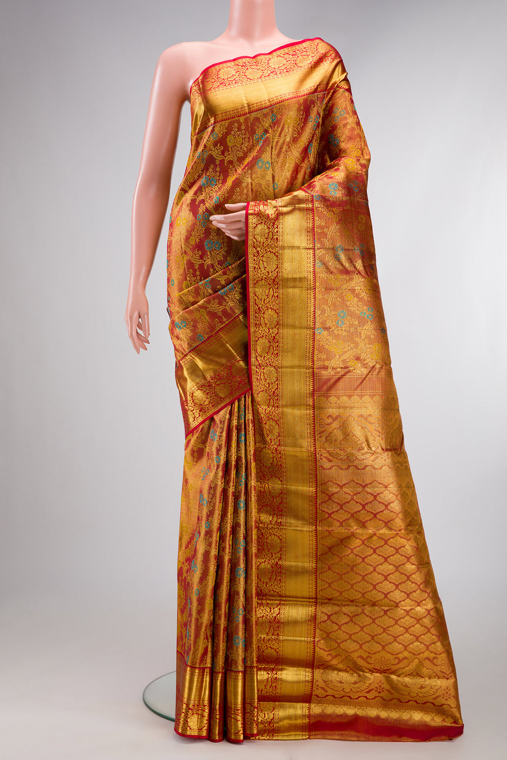 Pure Silk Maroon Dual Tone Kanjivaram Tissue Saree with Zari Brocade on the body and Zari Border.  displayed on a mannequin