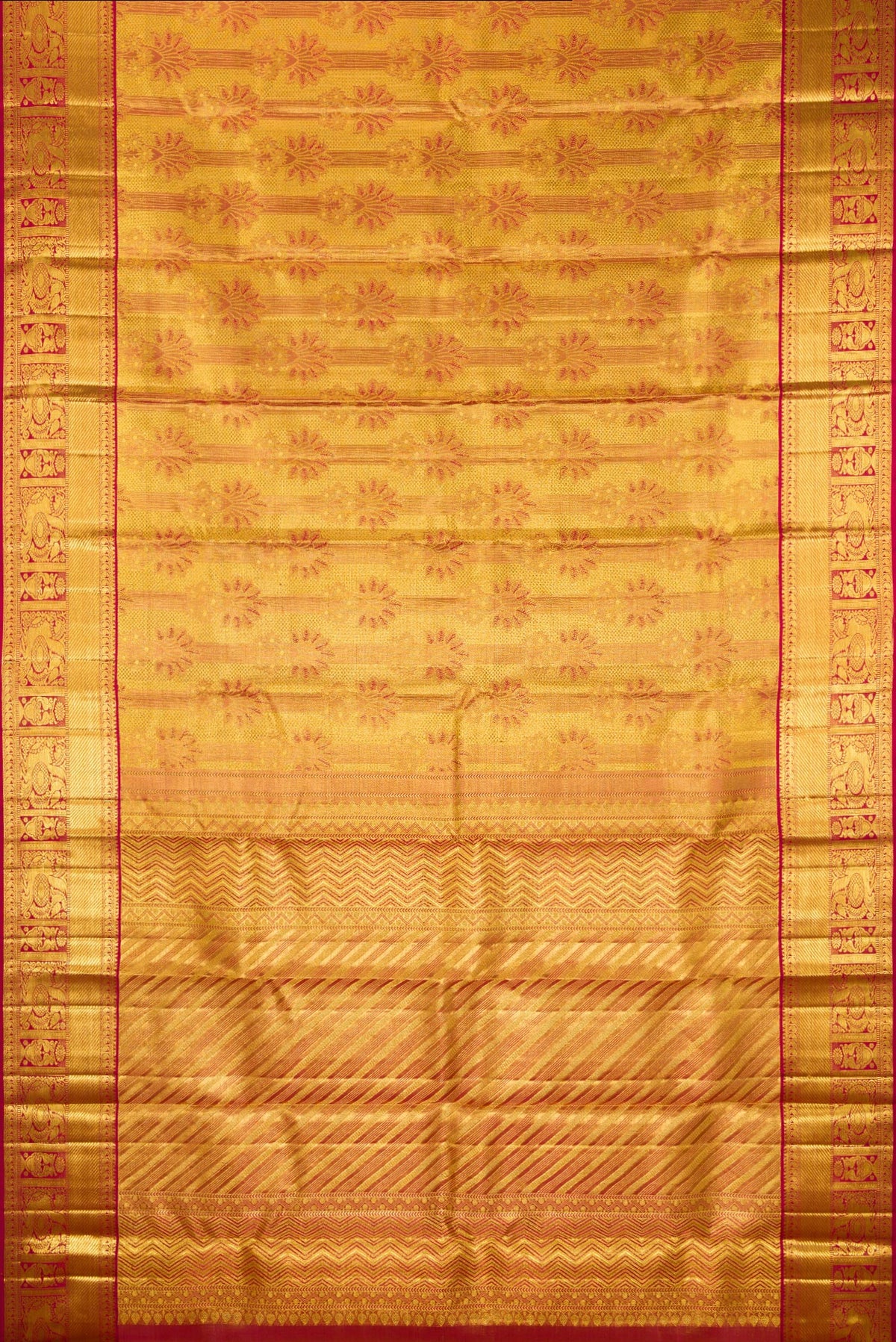 Flat view of Gold Dual Tone Kanchipuram Tissue Saree with Zari Brocade on the body and Zari Border. 