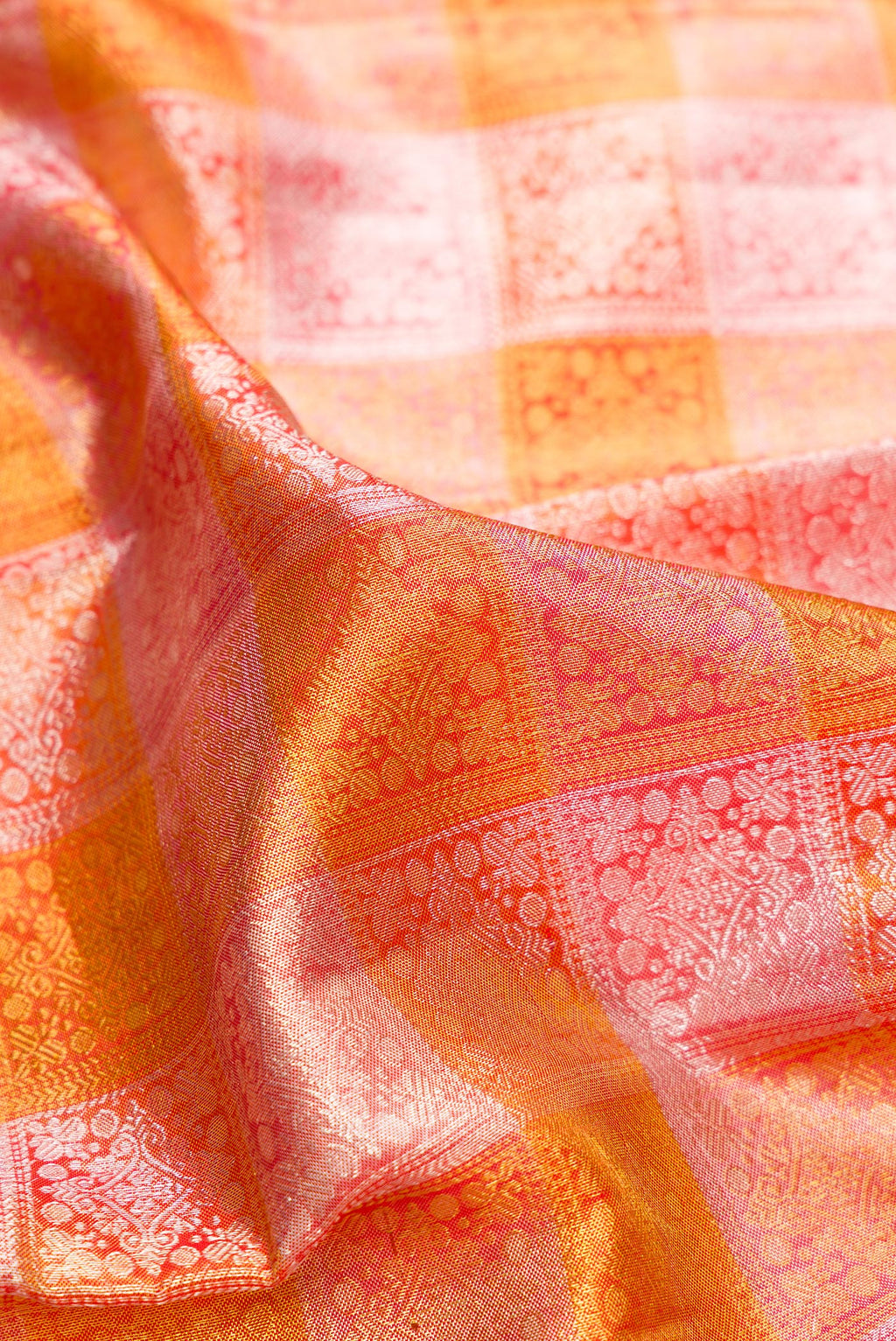 Close up of Multi Color Kanchipuram Tissue Saree with Zari Brocade on the body and Zari Border.  displaying folds