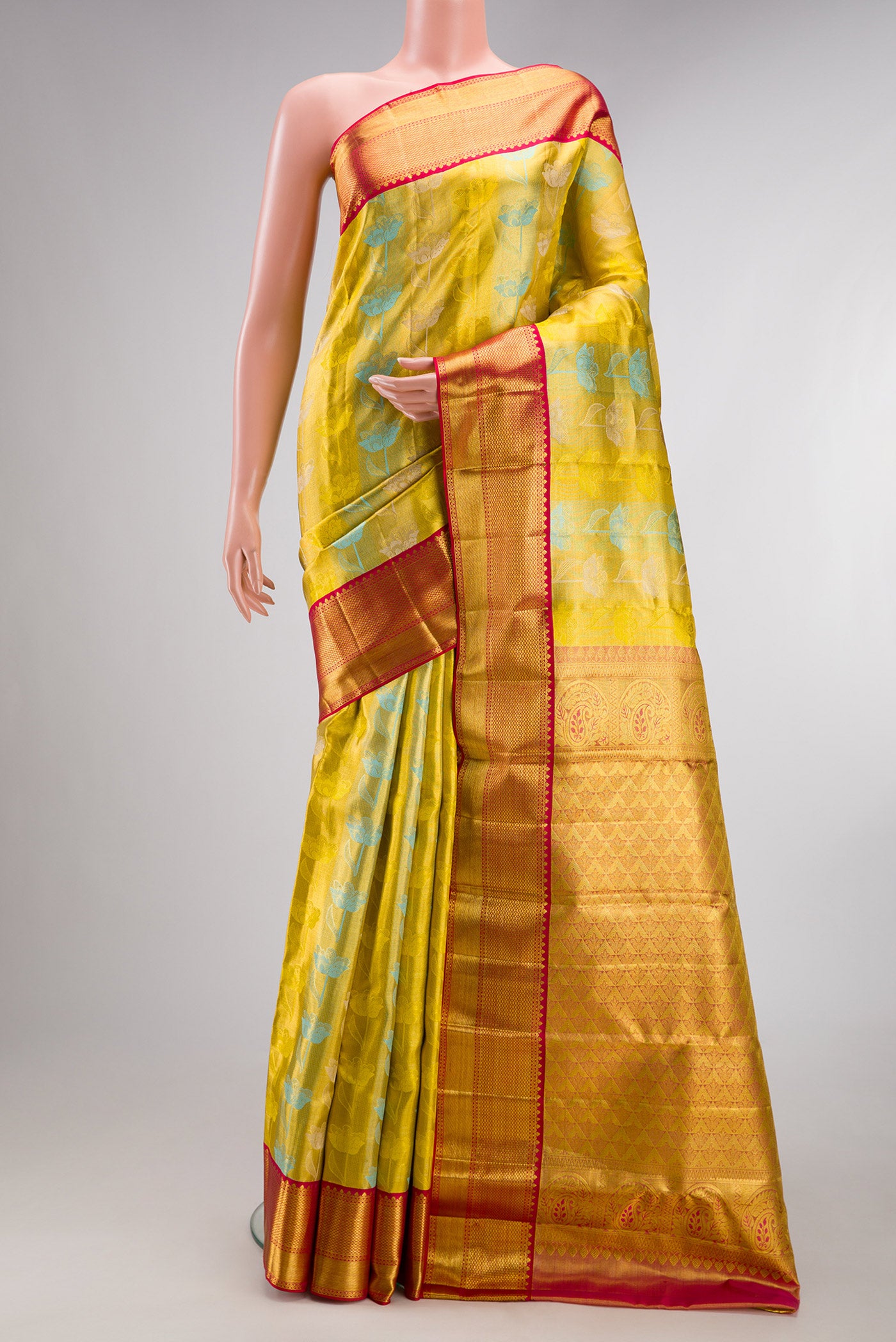 Pure Silk Yellow Dual Tone Kanchipuram Tissue Saree with Zari Brocade on the body and Zari Border.  displayed on a mannequin