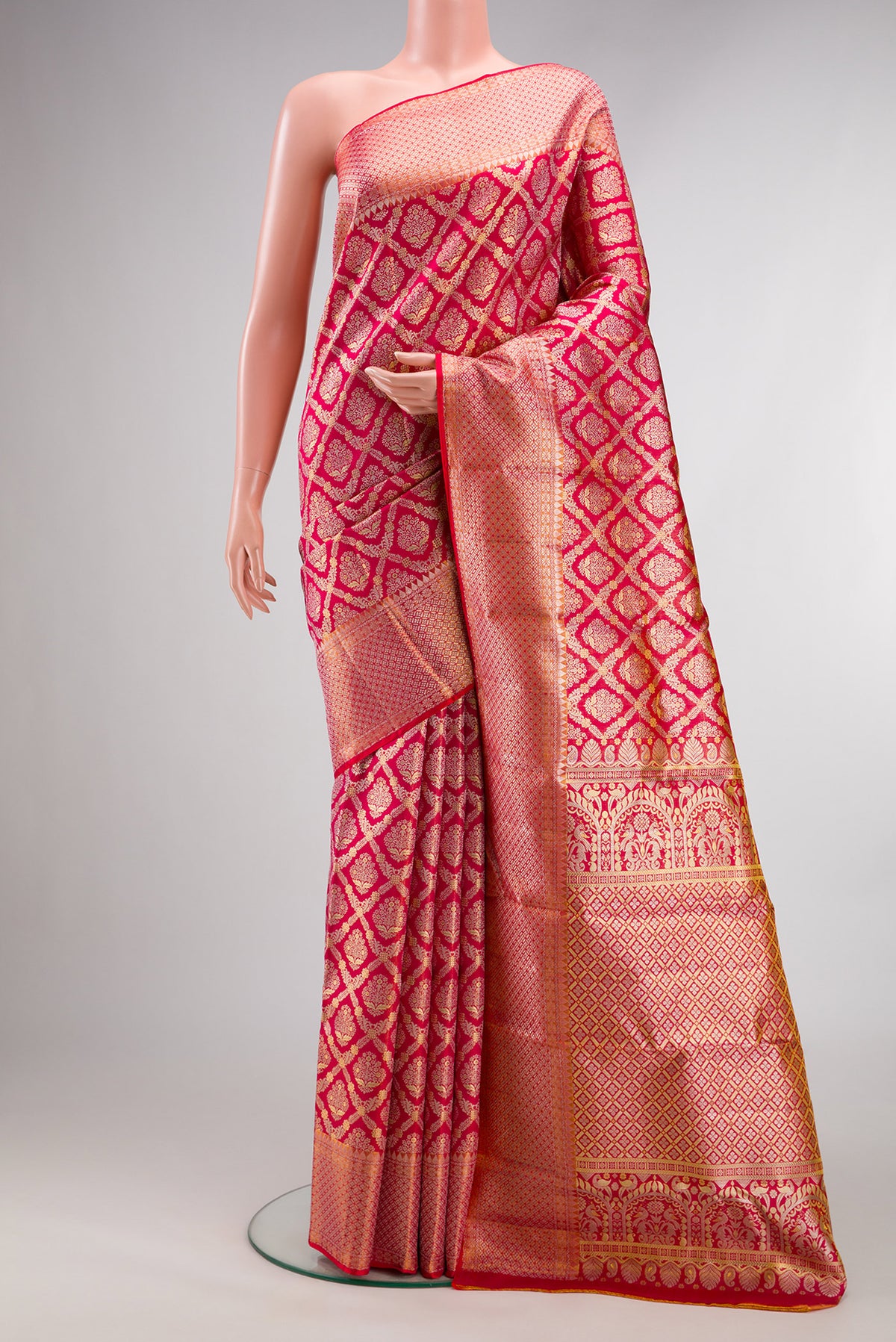 Dark Pink Dual Tone Kanchipuram Tissue Saree with Zari Brocade on the body and Fancy Border.  displayed on a mannequin