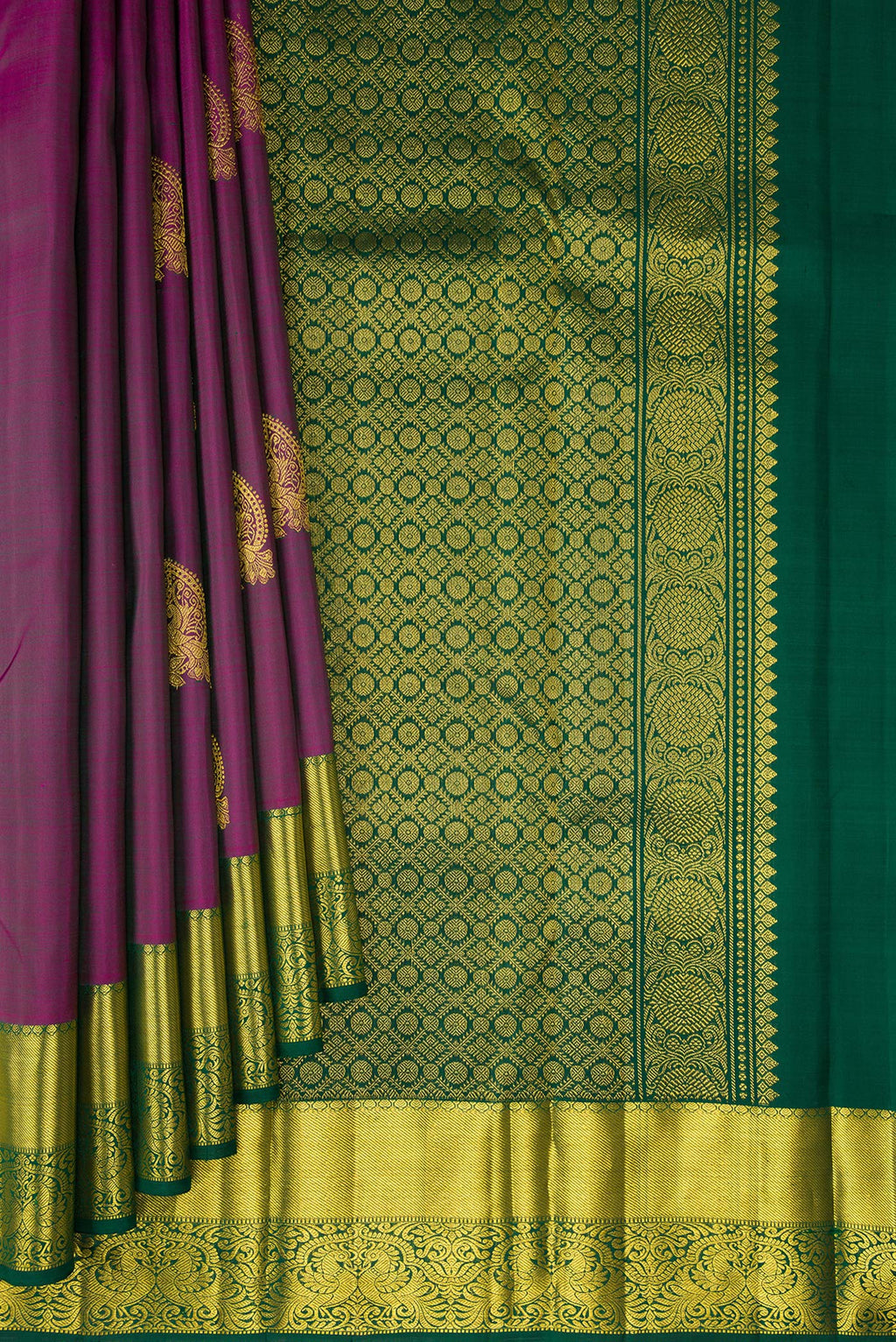 Pleats and pallu of Pure Silk Purple Kanjivaram Saree with Zari Butta on the body and Zari Border. 