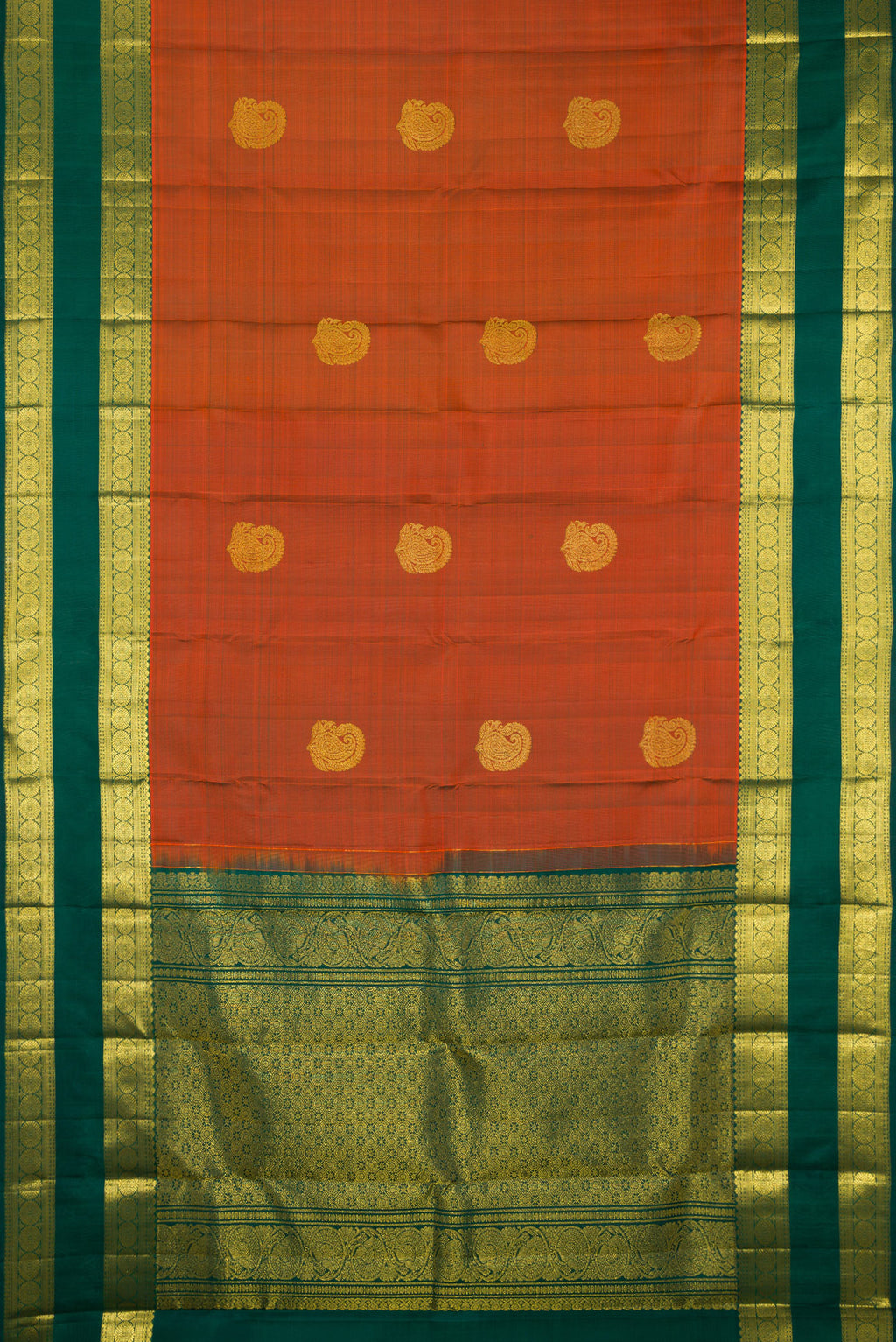 Flat view of Pure Silk Rust Kanchipuram Saree with Zari Butta on the body and Zari Border. 
