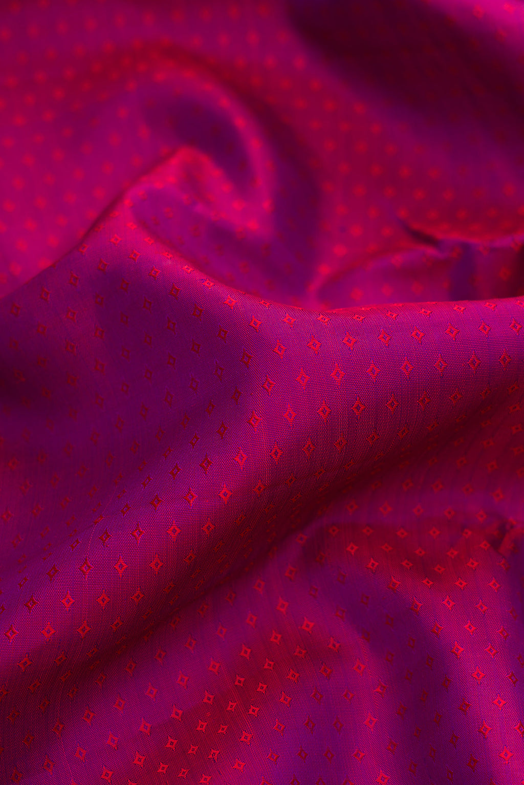 Close up of Pure Silk Purple Dual Tone Kanchipuram Saree with Jacquard design on the body and Zari Border.  displaying folds
